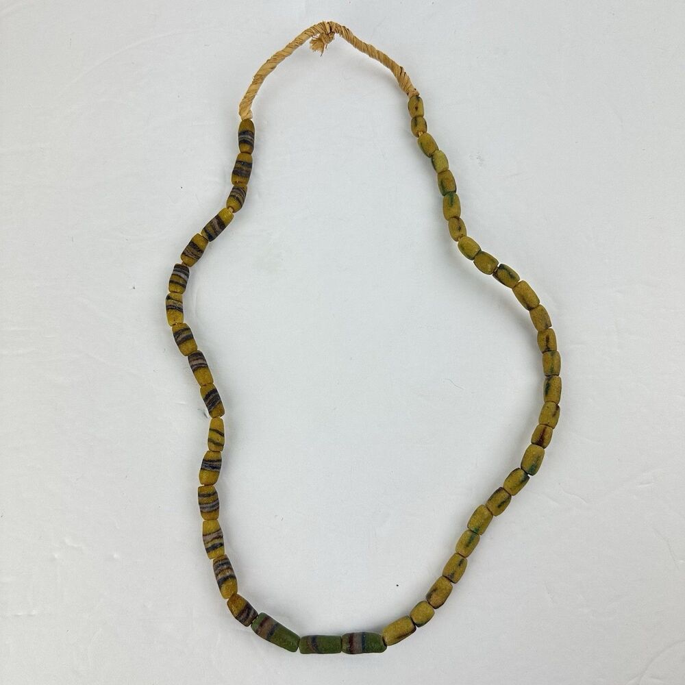 African Sand Cast Glass Trade Beads Handmade Green Earthtone Brown on Grass